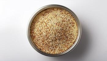 Small container containing quinoa grains, placed in the center of a white background photo
