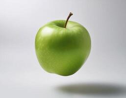 Green apple floating in the air on a clean white background photo