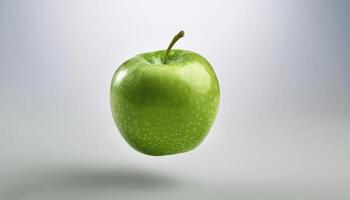 Green apple floating in the air on a clean white background photo