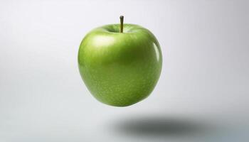 Green apple floating in the air on a clean white background photo