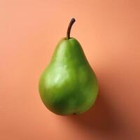 A green pear on a peach background photo