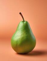 A green pear on a peach background photo