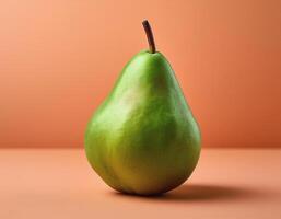 A green pear on a peach background photo