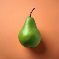 A green pear on a peach background photo
