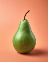 A green pear on a peach background photo