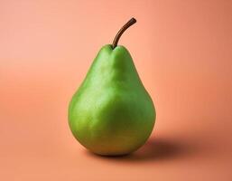 A green pear on a peach background photo