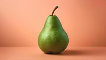 A green pear on a peach background photo