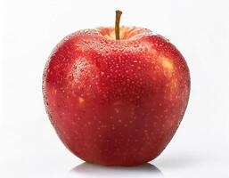 Bright red apple isolated on white background, highlighting the water droplets that stick to it. photo