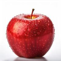 Bright red apple isolated on white background, highlighting the water droplets that stick to it. photo