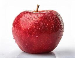 Bright red apple isolated on white background, highlighting the water droplets that stick to it. photo