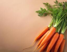 Fresh orange carrots on a beige background photo