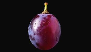 One purple grape isolated on a black background, showing the details of the skin and texture photo