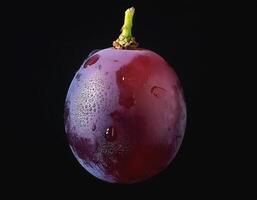 One purple grape isolated on a black background, showing the details of the skin and texture photo