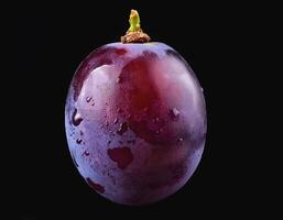 One purple grape isolated on a black background, showing the details of the skin and texture photo