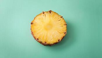 One slice of pineapple on a mint background photo