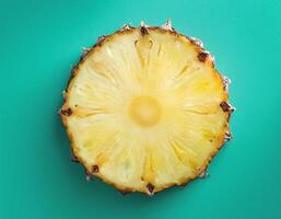 One slice of pineapple on a mint background photo