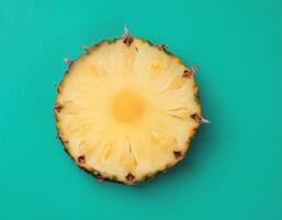 One slice of pineapple on a mint background photo