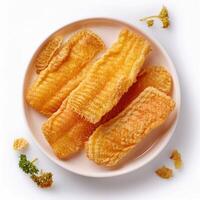 Fried fish fillets on a white plate photo
