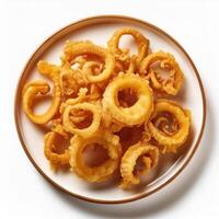 A plate of fried squid rings on a white surface photo
