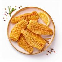 Fish fillets with lemon and spices on a plate photo