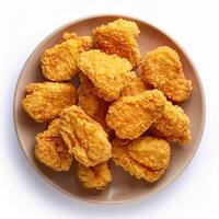 A plate of fried chicken nuggets on a white background photo