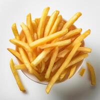 French fries in a bowl on a white surface photo