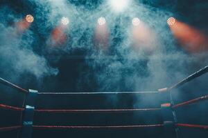 boxing ring is set under low lighting with spotlights casting beams and smoke swirling around the ropes enhancing the anticipation of the upcoming fight. photo