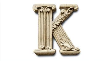 letter K in an ornate antique column texture stands out against a pristine white background, highlighting its artistic details and historical charm. photo