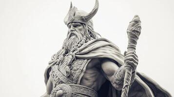 sculpture features Odin the revered Scandinavian god depicted with a majestic presence long beard and traditional armor holding a staff in a commanding pose. photo
