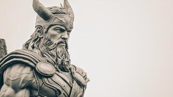 A striking representation of Thor the Scandinavian god showcases his powerful figure and iconic hammer. The sculpture captures the essence of Norse mythology in a minimalist setting. photo