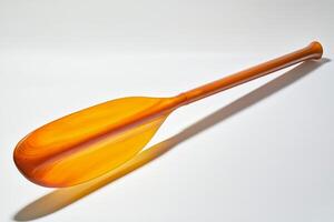 kayak paddle features a sleek blade and comfortable grip illuminated against a clean white backdrop emphasizing its design and craftsmanship for water sports enthusiasts. photo