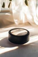 close up features a hockey puck with a textured surface and an embossed logo set against a white background with bright lighting and subtle shadowing showcasing its design. photo