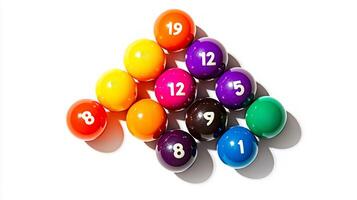 colorful arrangement of billiard balls is perfectly positioned in a triangle formation showcasing their glossy surfaces and numbered labels under midday lighting. photo