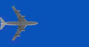 Airplane bottom, isolated color. Plane flying directly below and leaves a vapor trails behind on blue chromakey background video