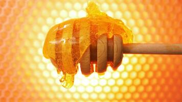 Honey on honey dipper. Spoon spindle with honeycomb on background video