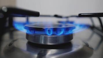 Kitchen stove gas burner. Natural gas ignition on the burner, close-up view video