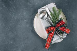 New Year's festive table setting with cutlery and decorations. Top view, flat lay photo