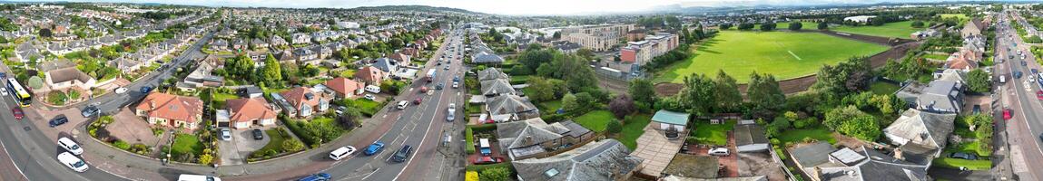 High Angle Wide Panoramic View of Central Edinburgh City of Scotland United Kingdom During Partly Cloudy Day of August 29th, 2024 photo