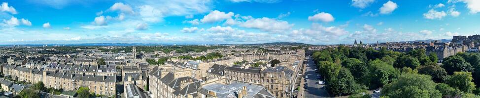 High Angle Wide Panoramic View of Central Edinburgh City of Scotland United Kingdom During Partly Cloudy Day of August 29th, 2024 photo