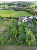 High Angle View of British Agricultural Farms at Streatley Village and Countryside Landscape of Bedfordshire, England Great Britain of UK. Footage Was Captured with Drone's Camera on October 7th, 2024 photo