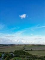 High Angle View of British Agricultural Farms at Streatley Village and Countryside Landscape of Bedfordshire, England Great Britain of UK. Footage Was Captured with Drone's Camera on October 7th, 2024 photo