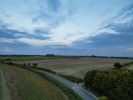 High Angle View of British Agricultural Farms at Streatley Village and Countryside Landscape of Bedfordshire, England Great Britain of UK. Footage Was Captured with Drone's Camera on October 7th, 2024 photo