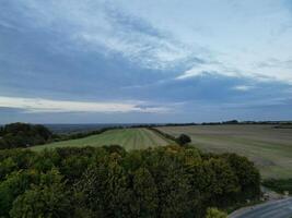 High Angle View of British Agricultural Farms at Streatley Village and Countryside Landscape of Bedfordshire, England Great Britain of UK. Footage Was Captured with Drone's Camera on October 7th, 2024 photo