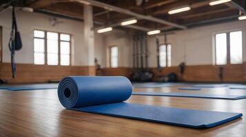 Black pilates fitness yoga mat for exercise in the gym photo