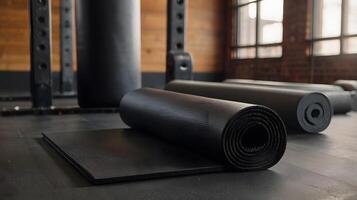Black pilates fitness yoga mat for exercise in the gym photo