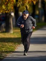 Old Aging Senior Man is running photo