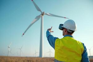 construction worker with outfit wearing VR headset with wind turbine in background photo