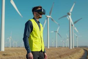 construction worker with outfit wearing VR headset with wind turbine in background photo