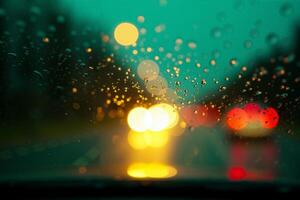 windscreen of car with rain drop water at night photo