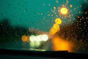windscreen of car with rain drop water at night photo